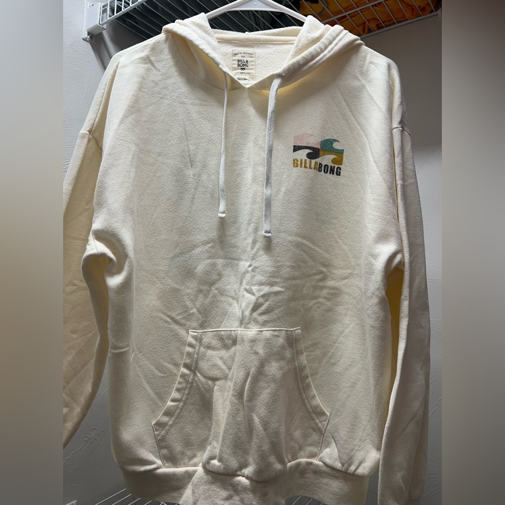 Cream colored Billabong hoodie, size large